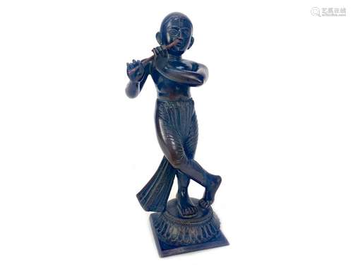 AN EASTERN BRONZE FIGURE OF A MUSICIAN