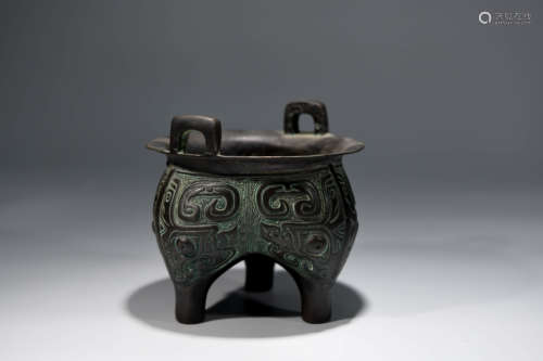 A Chinese Beast Pattern Copper Three-legged Vessel