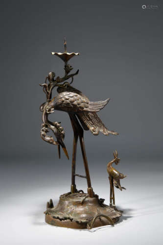 A Chinese Copper phoenix Shaped Candlestick