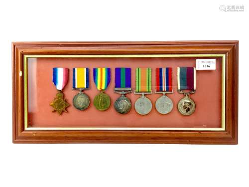 A FRAMED WORLD WAR MEDAL GROUP RELATING TO THE LOGUE FAMILY
