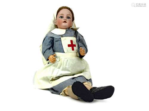 AN EARLY 20TH CENTURY BISQUE HEADED DOLL