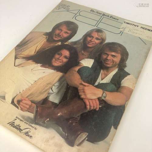 AN AUTOGRAPHED COPY OF THE GREAT SONGS OF ABBA