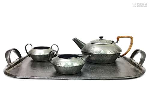 A TUDRIC PEWTER TEA SERVICE AND TRAY