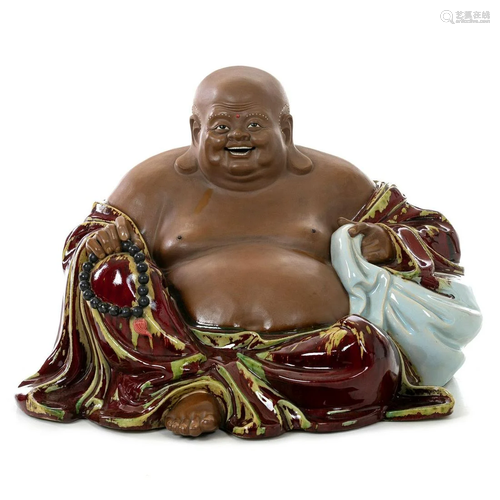 Large Chinese Ox blood glazed stoneware Buddha