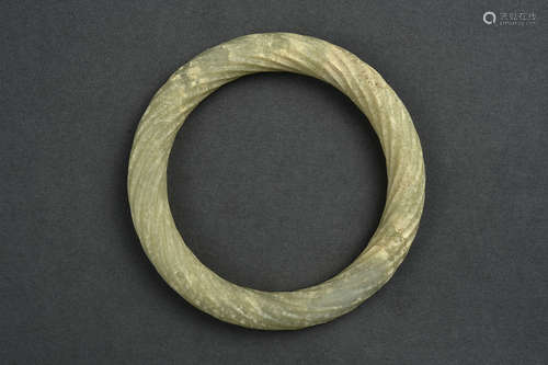 A WHITE JADE TWISTED BANGLE HAN DYNASTY