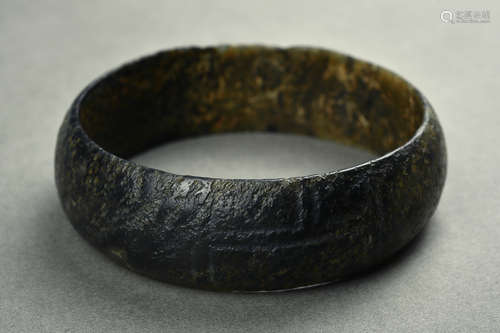 A RUSSET JADE BANGLE SHANG DYNASTY