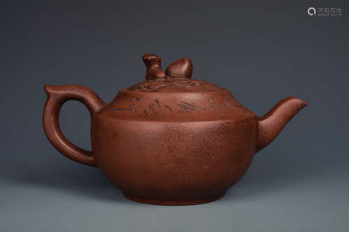 A YIXING GLAZED TEAPOT