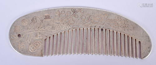 A CHINESE WHITE METAL COMB. 11 cm wide.