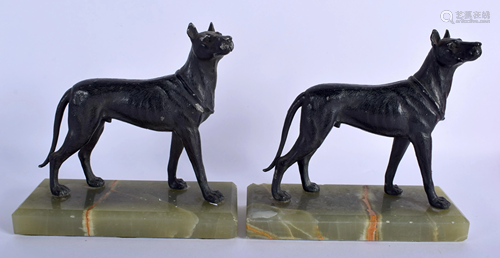 A PAIR OF ART DECO SPELTER HOUNDS upon onyx…