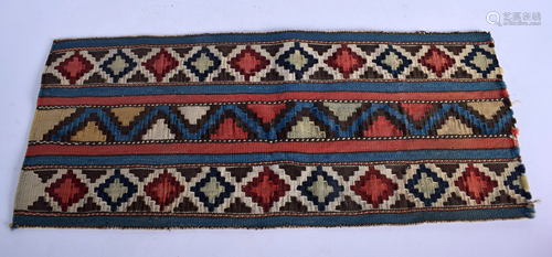 AN ANTIQUE MIDDLE EASTERN RUG FRAGMENT. 60…