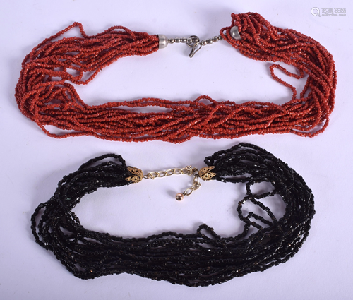 TWO CONTINENTAL CORAL NECKLACES. (2)