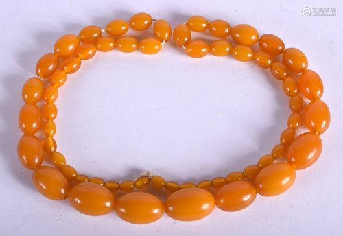 A 1930S EUROPEAN HONEY BEAD NECKLACE pos…