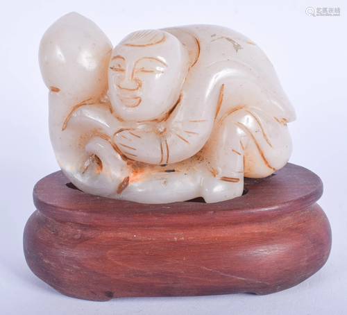 A CHINESE CARVED AGATE FIGURE OF A BOY 20t…