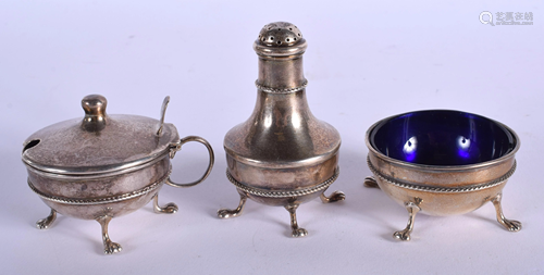 AN ANTIQUE LIBERTY & CO SILVER CONDIMENT SET.