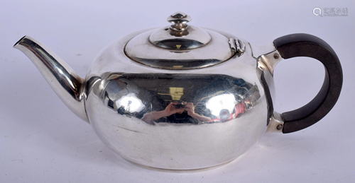 A SILVER LIBERTY & CO SILVER TEAPOT with heraldic