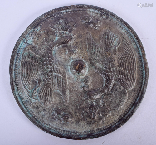 A CHINESE BRONZE HAND MIRROR. 11 cm wide.