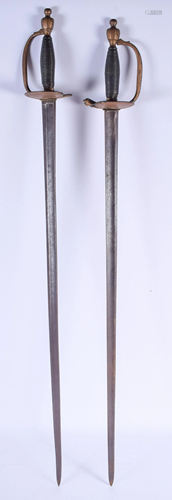 A PAIR OF VINTAGE SWORDS. 95 cm long.