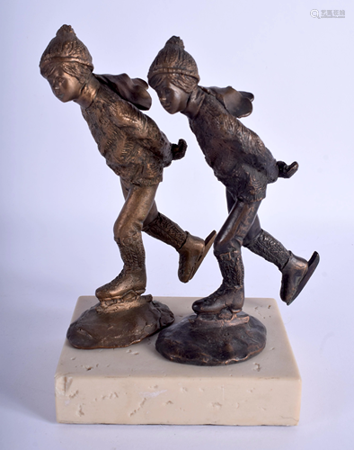 A PAIR OF BRONZE SKATERS. Bronze 15 cm high.