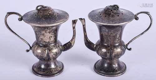 A PAIR OF VINTAGE STERLING SILVER TEAPOTS. 2.…