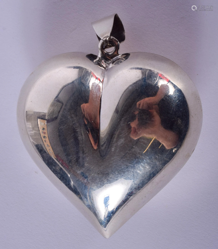 A SILVER HEART PENDANT. 5 cm x 5 cm.