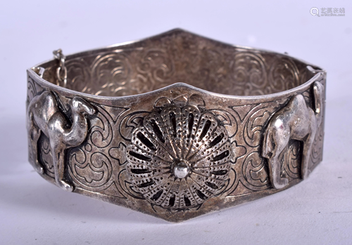 A VINTAGE INDIAN WHITE METAL BANGLE decor…