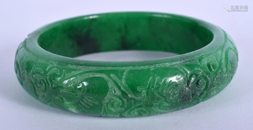 A CHINESE APPLE JADE BANGLE. 7.25 cm wide.