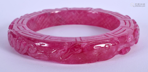 A CHINESE PURPLE JADE BANGLE. 7.5 cm wide.