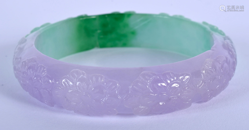 A CHINESE CARVED TWO TONE JADE BANGLE. 7.…