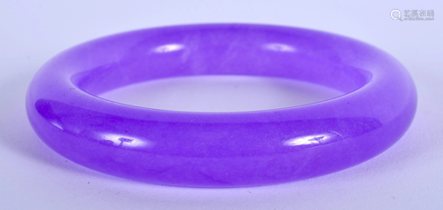 A CHINESE PURPLE JADE BANGLE. 7.5 cm wide.