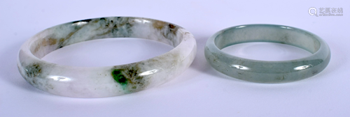 TWO CHINESE JADE BANGLES. Largest 8 cm wid…