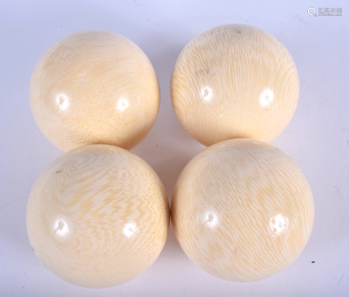 FOUR IVORINE BALLS. 5 cm wide. (4)