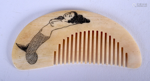 A NOVELTY BONE MERMAID COMB. 8 cm wide.