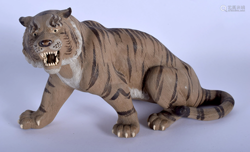 A 1950S CHINESE POTTERY FIGURE OF A TIGER …