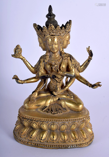 A CHINESE GILT BRONZE MULTI ARMED BUDD…