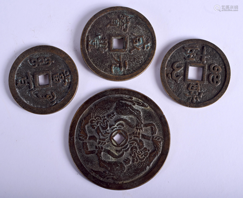 FOUR CHINESE BRONZE COINS. Largest 6.75 cm dia…