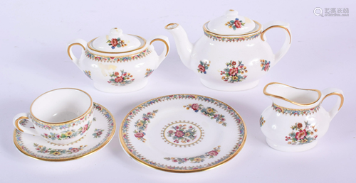 A MINIATURE COALPORT TEASET. Teapot 4 …