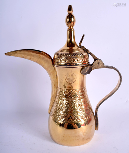 A MIDDLE EASTERN SILVER GILT EWER. 36 oz. 32…