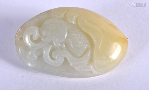 A CHINESE JADE AMULET. 4 cm x 3 cm.