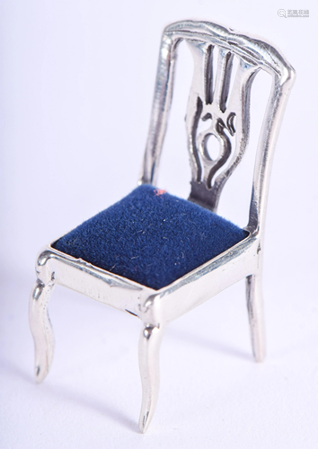 A SILVER CHAIR PIN CUSHION. 4 cm high.