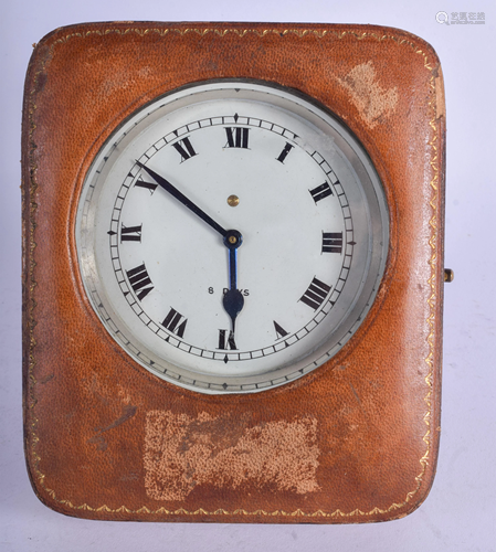 A VINTAGE EIGHT DAY CLOCK within a case. Clock …