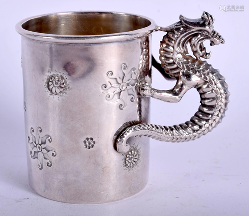 A WHITE METAL DRAGON CUP. 6 cm high.