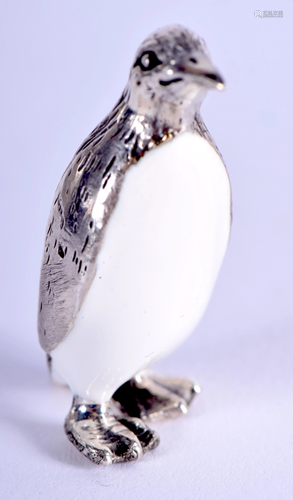 A SILVER AND ENAMEL PENGUIN. 2 cm high.