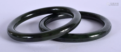 TWO CHINESE JADE BANGLES. 7 cm diameter. (2)