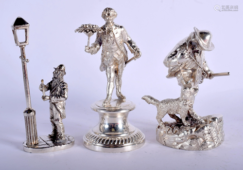 THREE SILVER PLATED FIGURES. Largest 12 cm high…