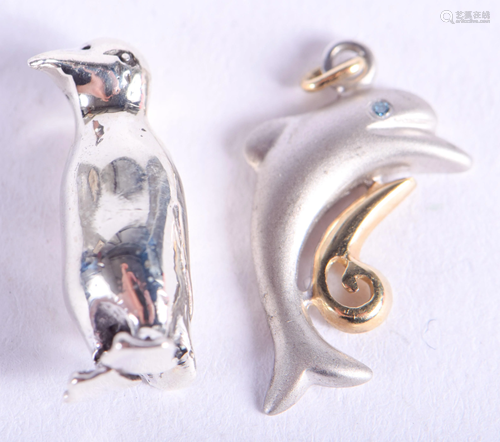 A SILVER PENGUIN and dolphin. (2)