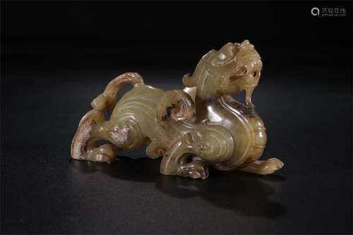 A CHINESE CARVED HETIAN JADE ORNAMENT