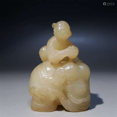 A CHINESE CARVED HETIAN JADE CHILD AND ELEPHANT ORNAMENT