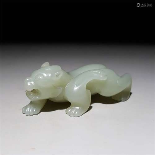 A CHINESE CARVED HETIAN JADE BEAST ORNAMENT