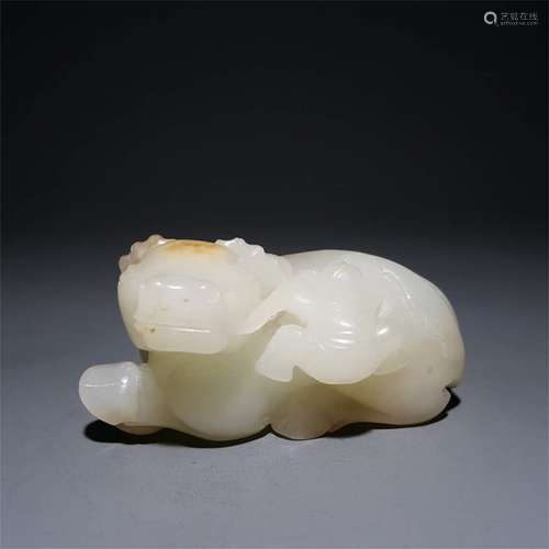 A CHINESE CARVED HETIAN JADE COW ORNAMENT