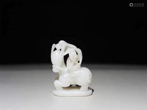 A CHINESE CARVED HETIAN JADE ORNAMENT, ZHANG GUOLAO RIDING A DONKEY BACKWARDS